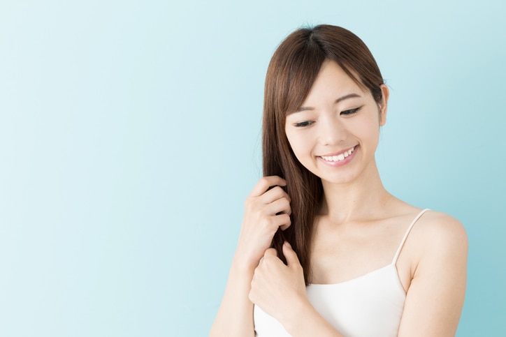 portrait of attractive asian woman beauty image on blue background