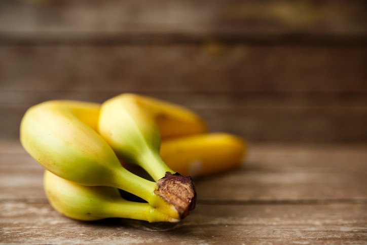 Bananas on wood table.