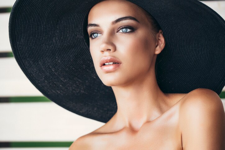 Portrait of a fresh and lovely woman wearing hat