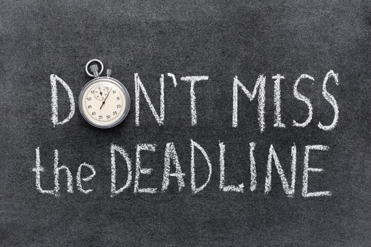 don’t miss the deadline concept handwritten on chalkboard with vintage precise stopwatch used instead of O