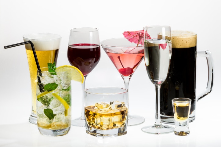 Various types of alcohol on a white background.