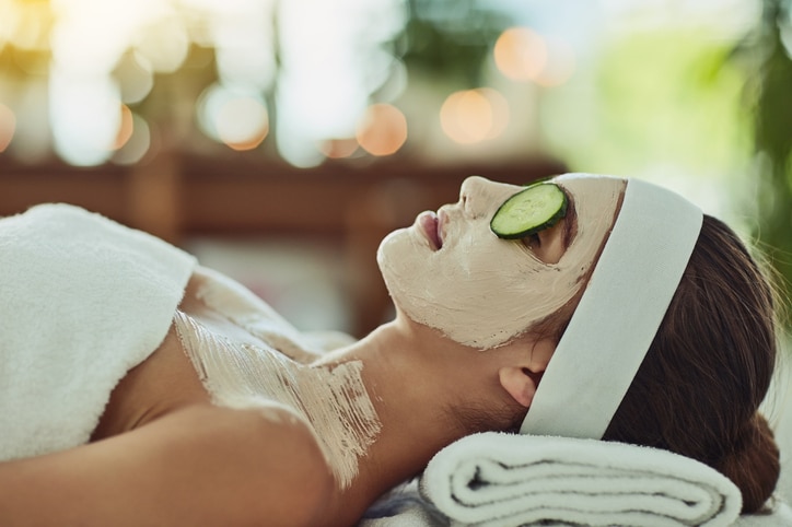 Shot of an attractive young woman relaxing on a massage bed at a beauty spa