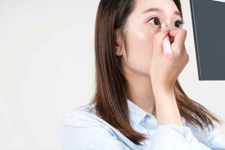 Closeup image of closed woman eye with beautiful bright makeup, smoky eyes