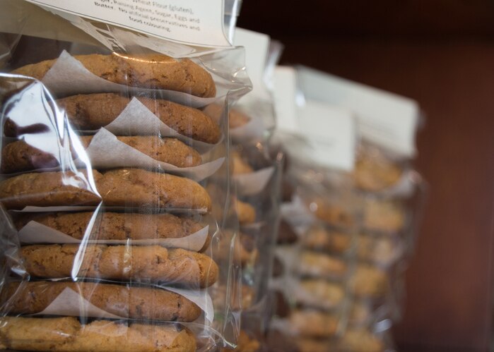 Close up of homemade biscuits packaged in cellophane packets on a shelf