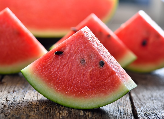 watermelon sliced on wooden background