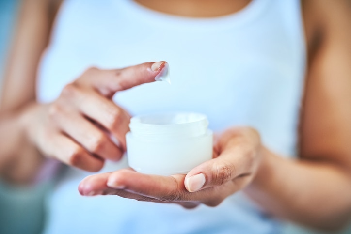 Cropped shot of an unrecognizable woman using a skincare product