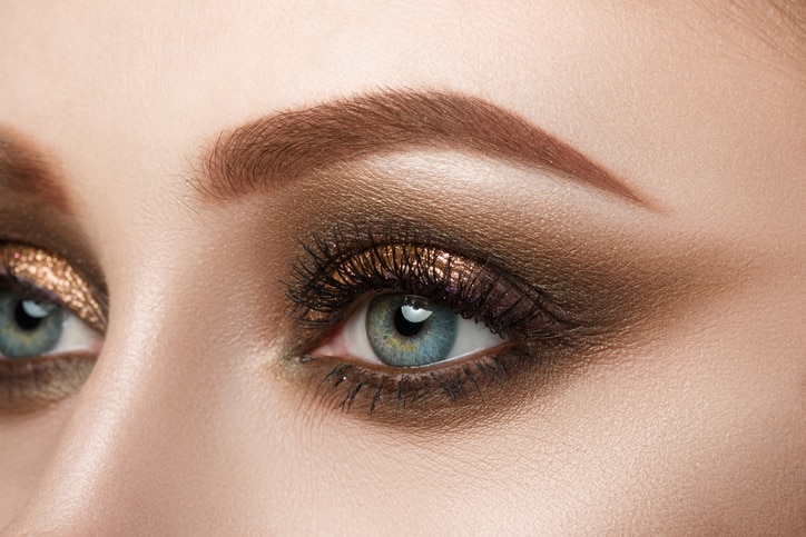 Close-up view of female blue eye with beautiful make-up. Perfect Make-up closeup.